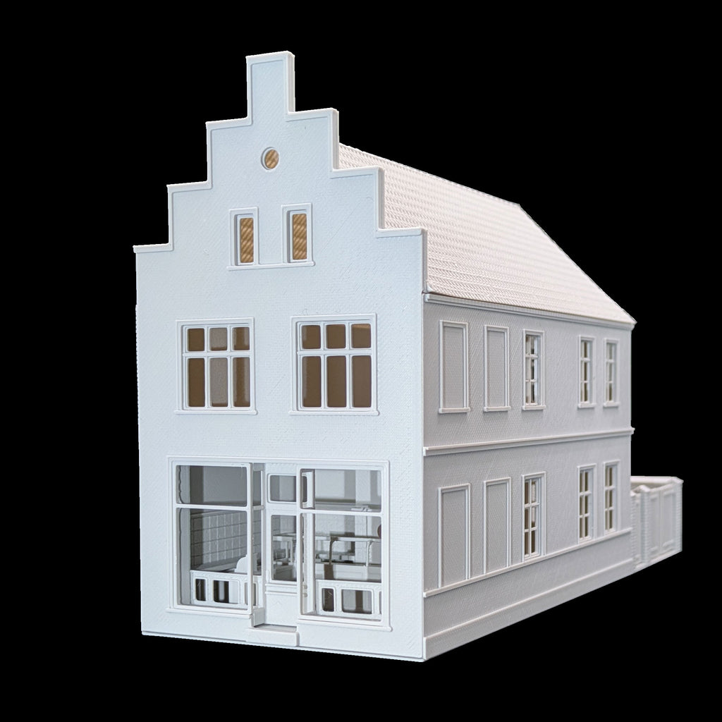 Perspektivische Seitenansicht eines Modellhauses in TT mit Ladengeschäft und detaillierter Fassadenstruktur.