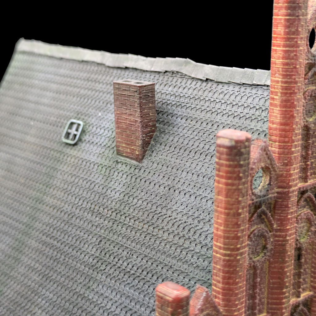 Draufsicht auf das Modell mit Fokus auf die Dachstruktur, das Dachfenster und den Schornstein.