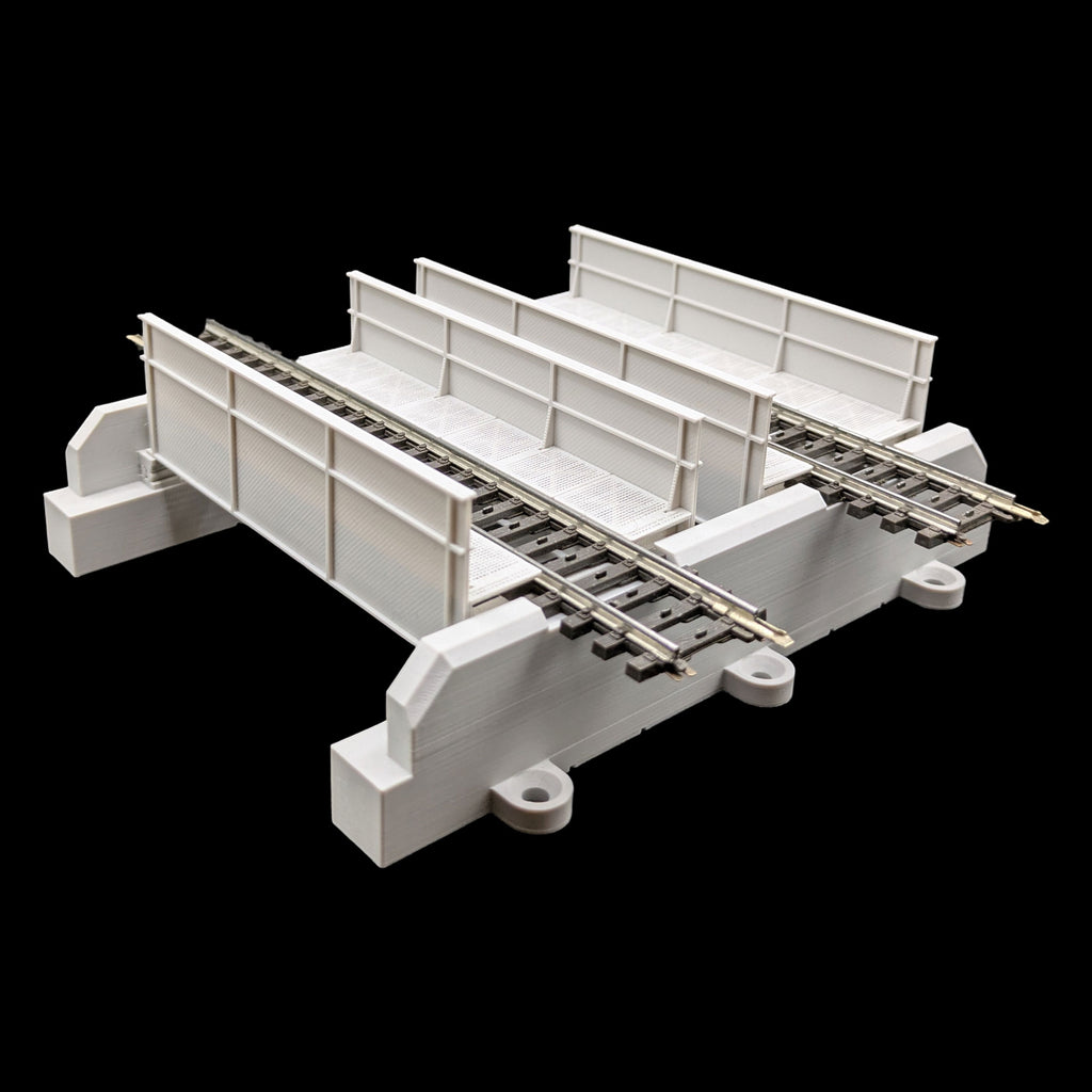 Seitenansicht der selbst entworfenen, zweigleisigen H0 Trogbrücke, zeigt die präzisen Verstrebungen und das graue 3D-Druck-Modell.