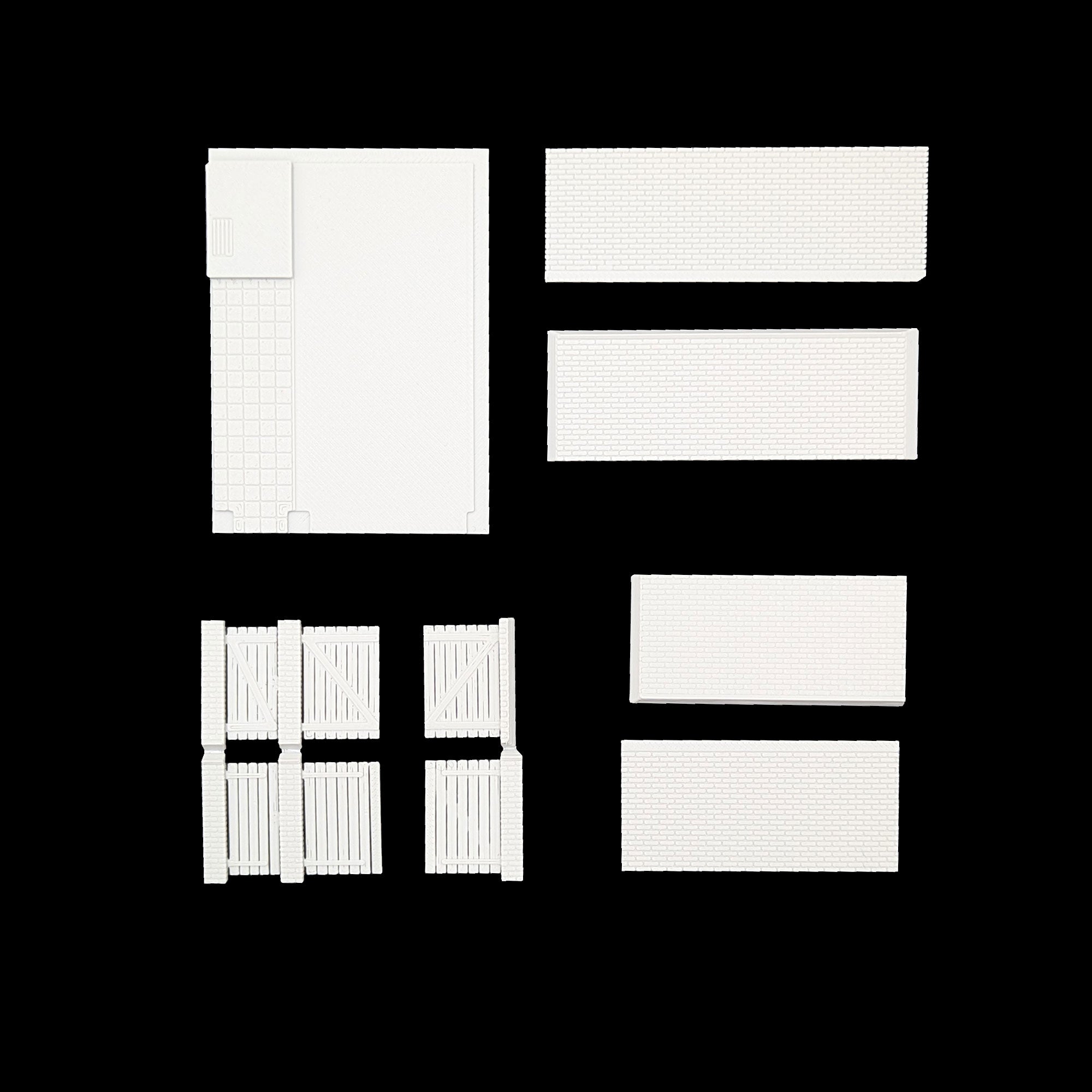 Zubehörteile des Bausatzes inklusive Backsteinmauer-Elementen und Hoftoren aus Kunststoff.